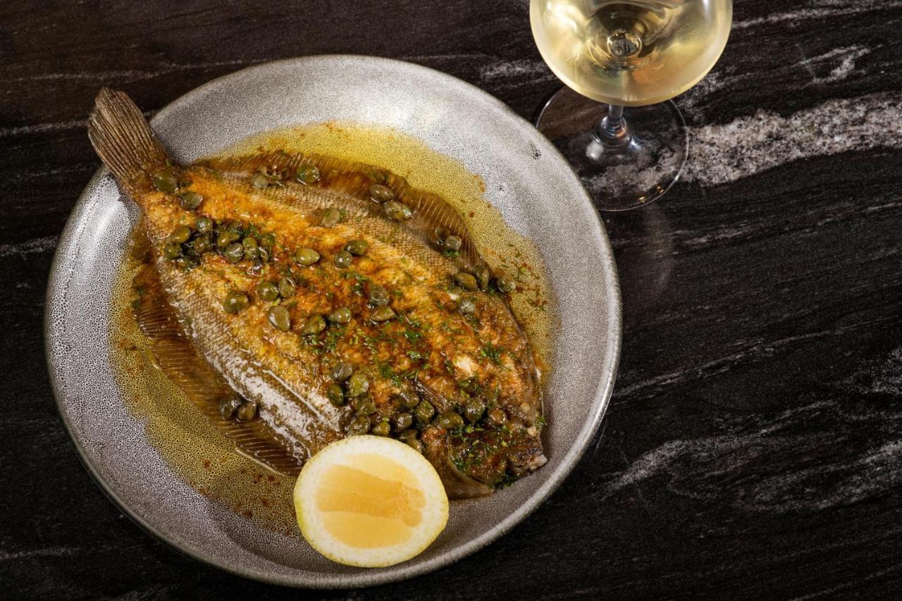 Qt Distretto di Queenstown Esterno foto A turbot prepared in a French restaurant